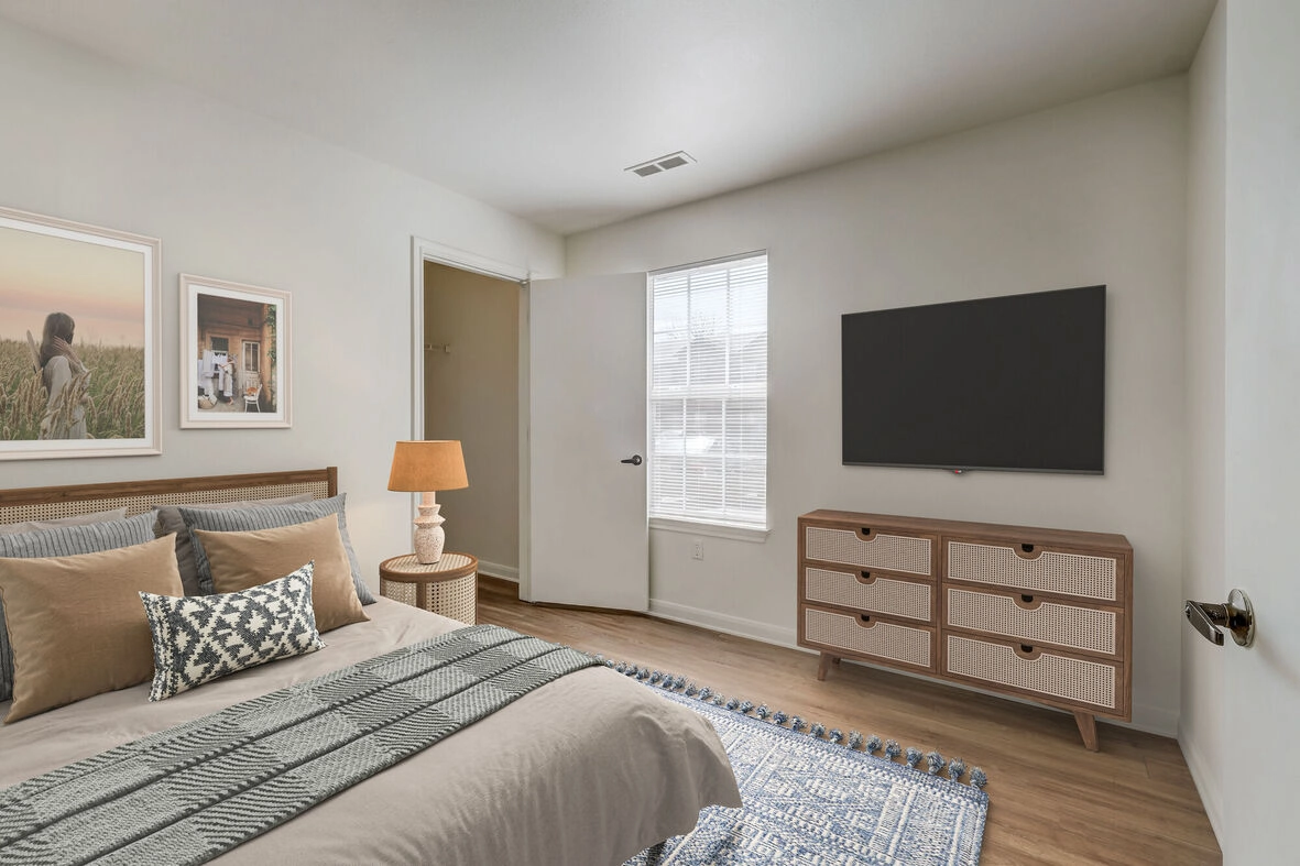 Bedroom with large window and walk in closet